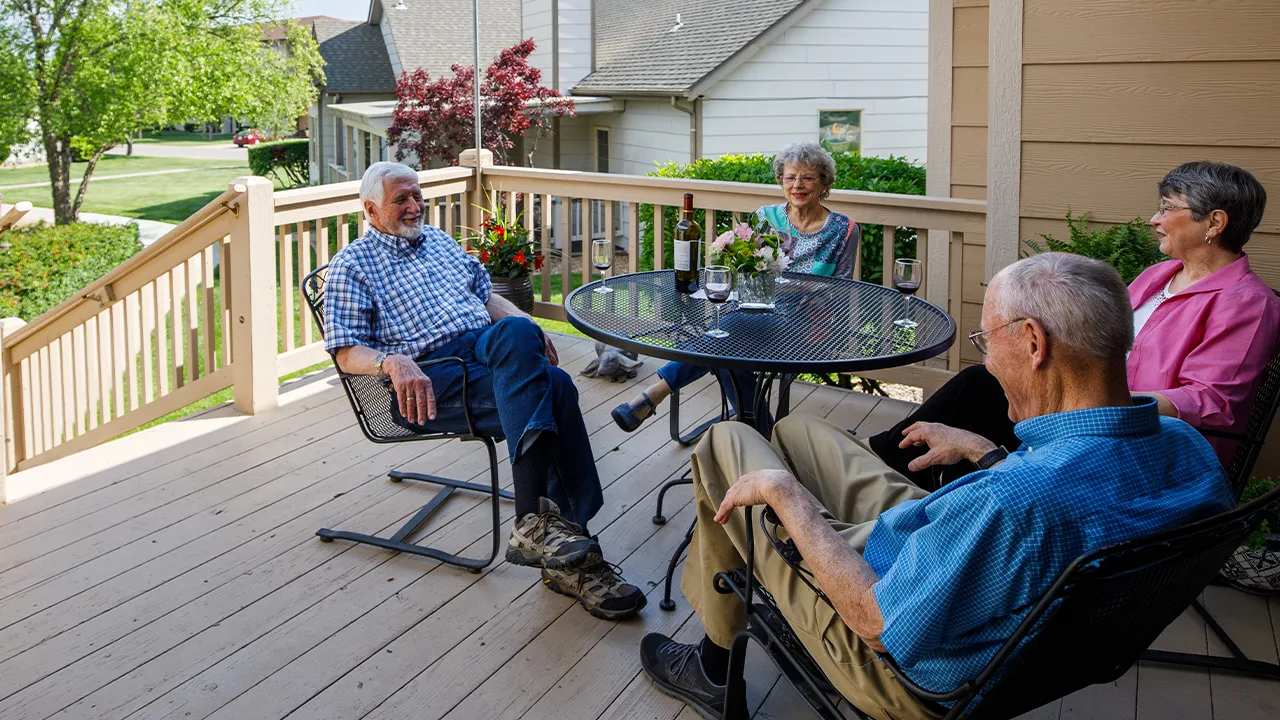 Residents enjoying conversation and wine